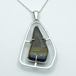 Tiger's eye silver pendant presented on a white background