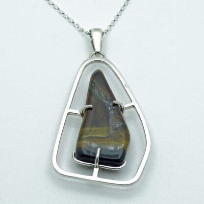 Tiger's eye silver pendant presented on a white background