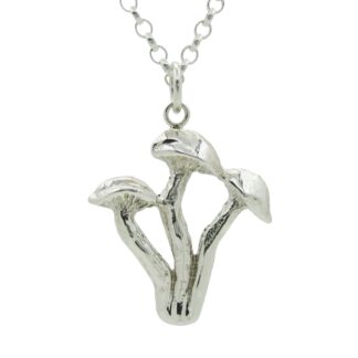 Silver triple mushroom pendant against a white background